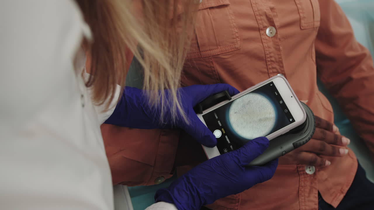 Dermatologist examines a skin professional doctor the dermatologist research a birthmark on the