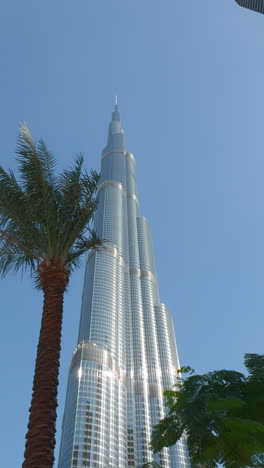 burj khalifa in dubai with palm trees