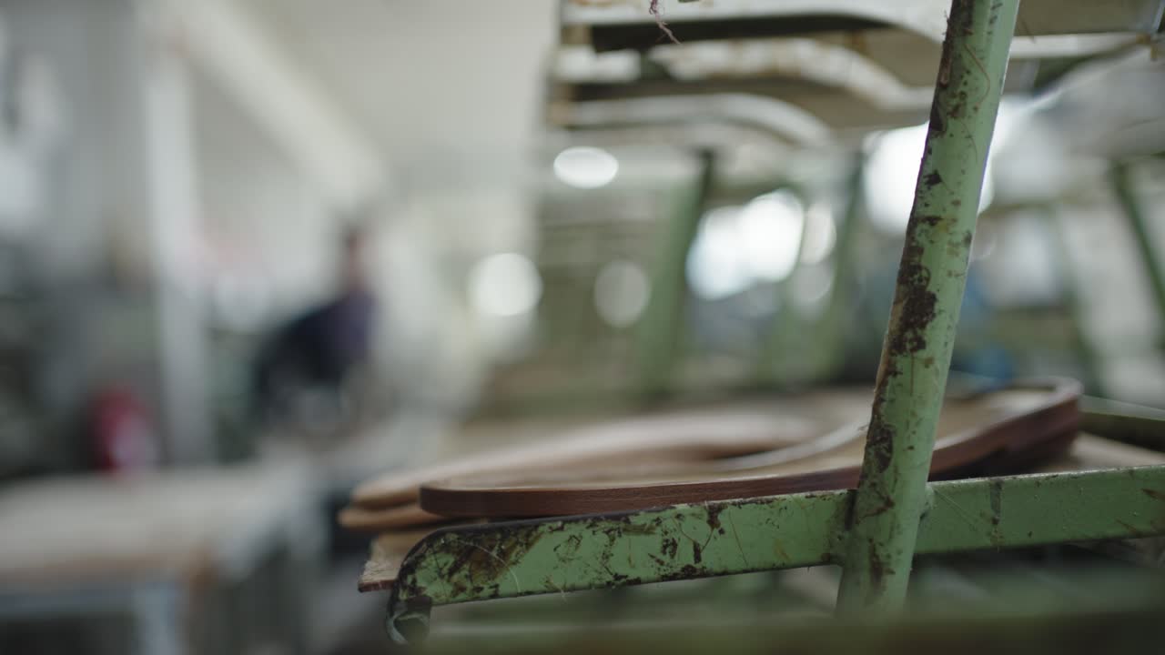 shoe manufacturing process on a conveyor system within a workshop environment