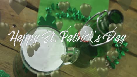 animation of st patrick's day text and green hearts and glass of beer on wooden background