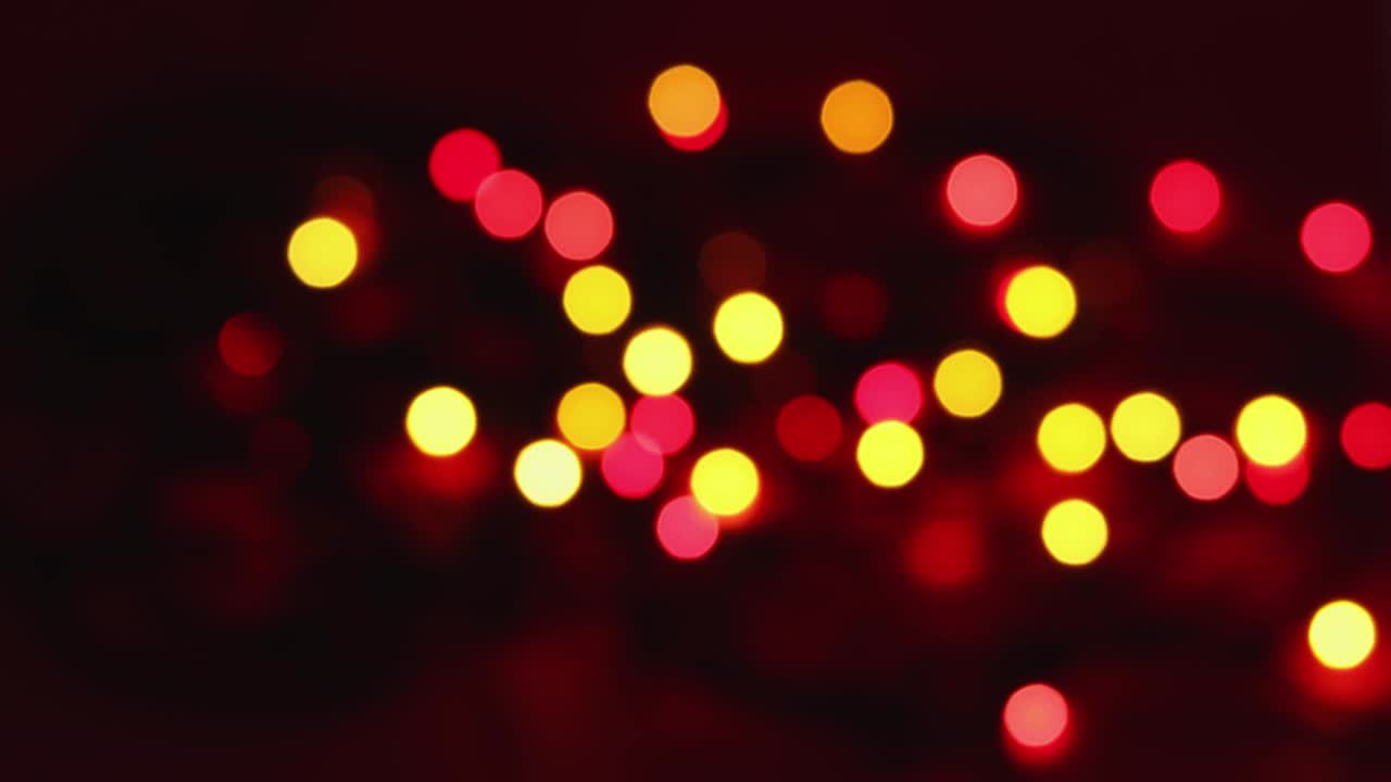 Shimmering abstract colored circles defocused christmas lights video.