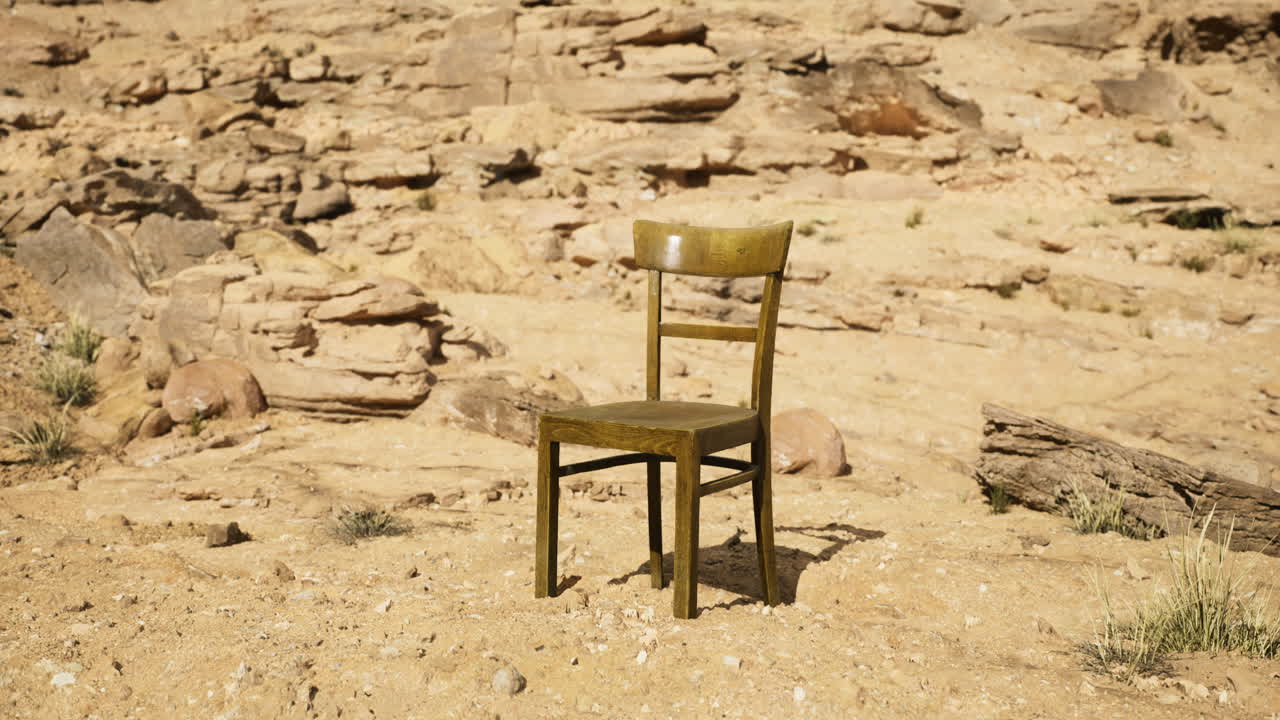 Lonely chair placed amidst rocky desert landscape under clear blue sky