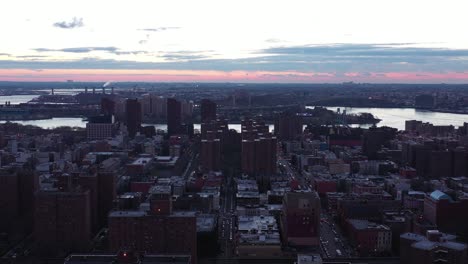 drone flyover new york city's harlem neighborhood at dawn daybreak blue hour sunrise