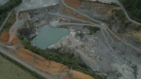 aerial view of open pit quarry with groundwater
