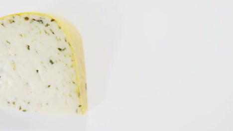 Slice-of-cheese-on-white-background