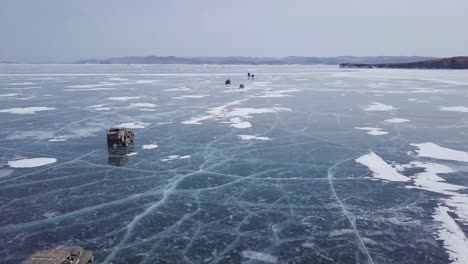 aerial-view-of-amazing-cinematic-rally-scene-on-frozen-lake-baikal-in-russia