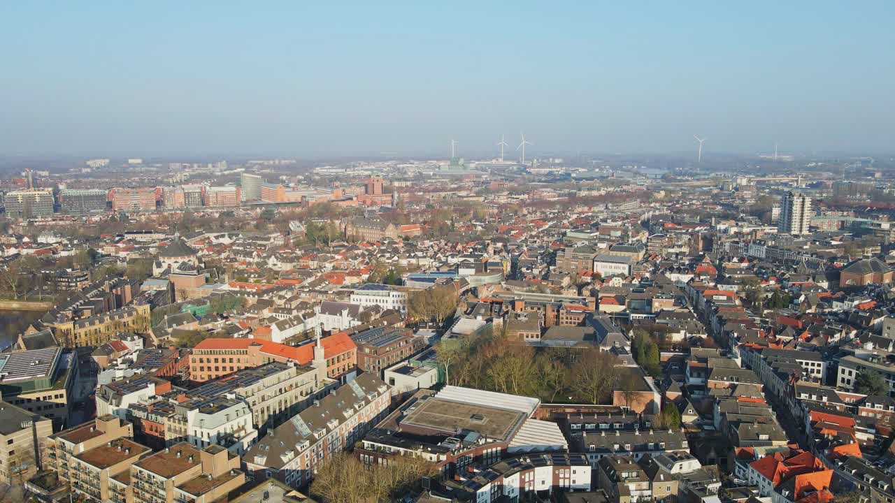 Beautiful aerial of the city of 's-Hertogenbosch in the Netherlands on a calm sunny day. Some of the homes and building have photovoltaic solar panels on the rooftops