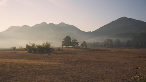 Panning-shot-of-the-low-lying-fog-at-the-ibradi-akseki-mountain-range,-desertification-and-climate-change