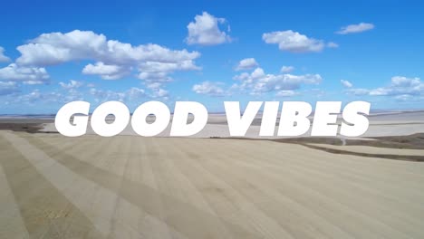 animation of good vibes text over landscape and clouds in background