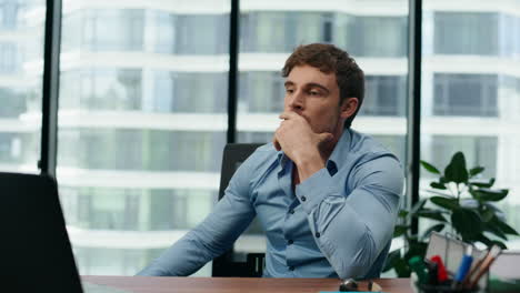man angry failure work sitting office desk close up. manager feeling disaster.