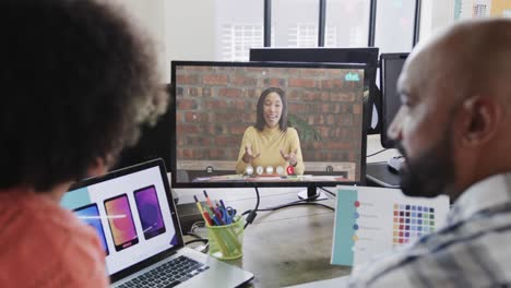 african american business people on video call with caucasian female colleague on screen