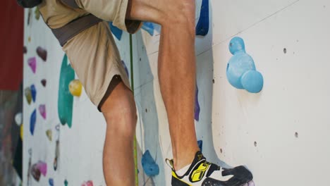 rock climbing on an indoor climbing wall