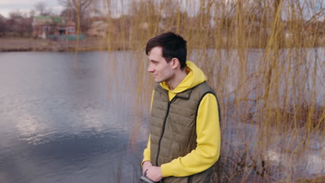 man and dog by the lake