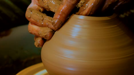 professional male potter working in workshop