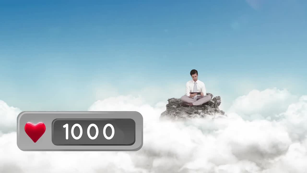 구름 위에 있는 바위 위에 앉아 있는 사람