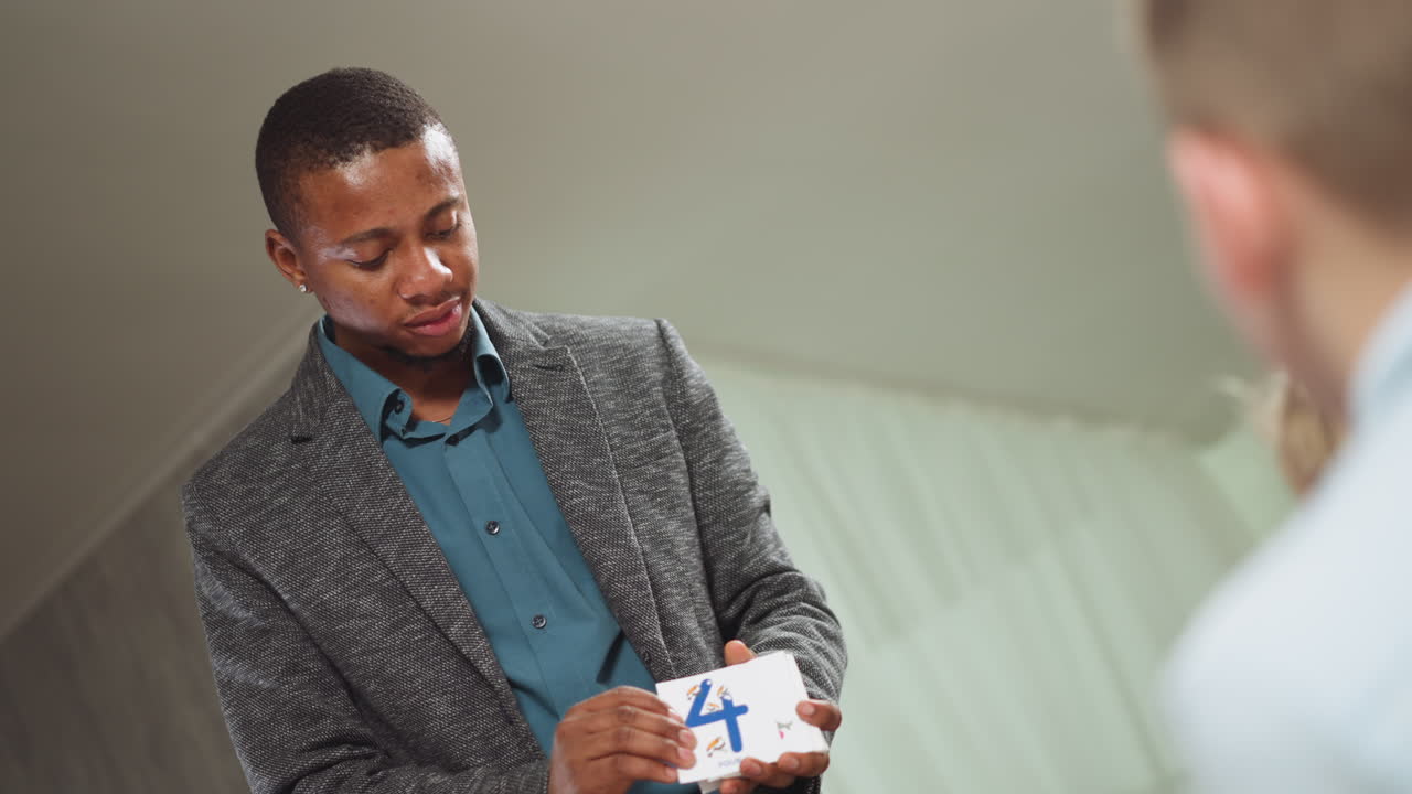 English tutor shows cards with digits letters to children