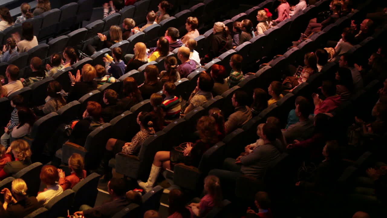 People at the theatre performance Shot from back High angle