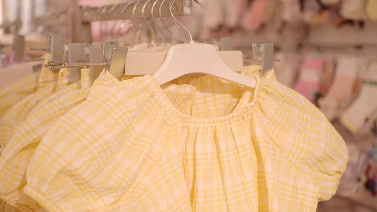 Yellow Checkered Children's Tops on Display