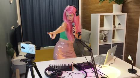 woman singing and streaming music in her home studio