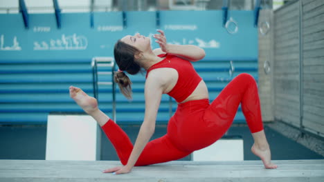 woman performing a yoga pose outdoors
