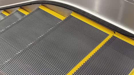closeup of escalator steps and safety features