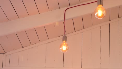 warm lighting in a white-painted wooden ceiling