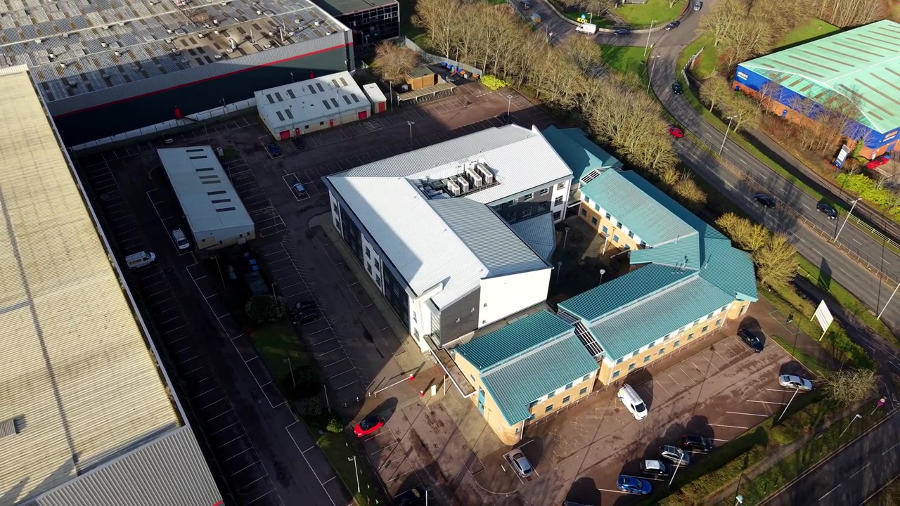 Aerial view of a modern industrial business district and logistics hub in Stevenage, UK.