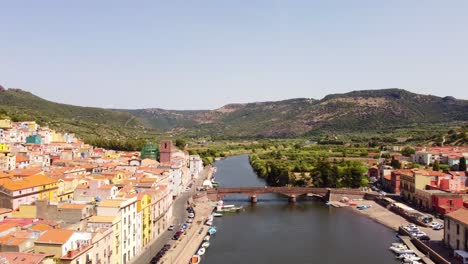 Bosa-establishing-view-of-river-Temo,-colorful-houses-buildings,-Sardinia,-day