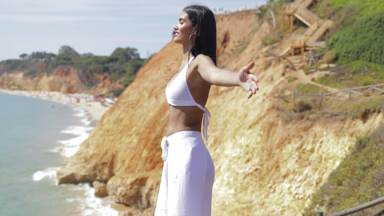 Dreaming model in white on landscape