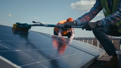 cleaning solar panels on a rooftop