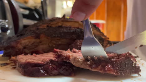 slow motion scene of freshly cut roast beef ready to be served