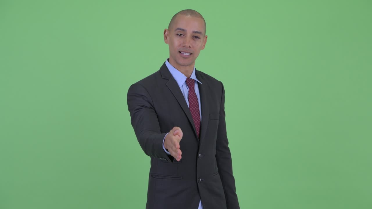 Happy handsome bald multi ethnic businessman