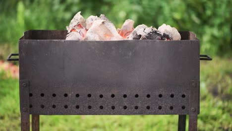 view of smoldering coal in the grill in nature,  4k footage