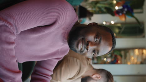 portrait of young african american man in cafe