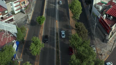 tilt up aerial view of street traffic in mexico city suburbia, naucalpan, lomas verdes avenue and gran terraza shopping mall