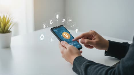 engaging with cryptocurrency: a close-up view of a user interacting with a mobile phone displaying bitcoin and blockchain icons in a modern digital workspace