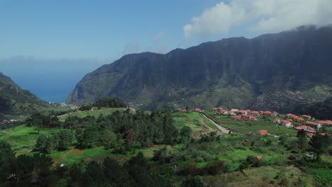 aerial view of a mountainous village by the ocean
