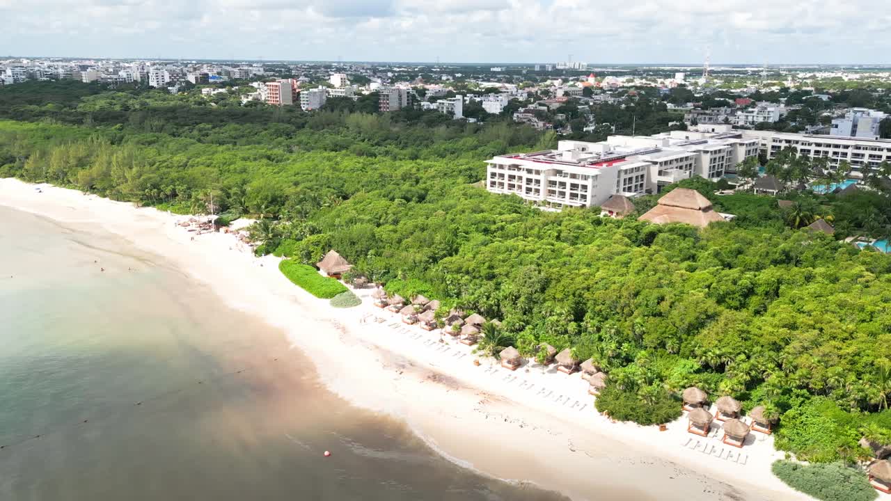 Little Thatched Huts And Tropical Trees At Playa Punta Esmeralda In Playa Del Carmen, Mexico. Aerial Drone Shot