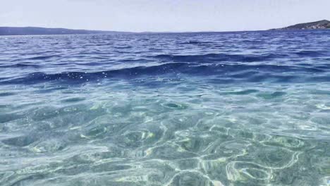Beautiful-crystal-clear-Adriatic-Sea-sparkling-on-summer-sun-in-Croatia