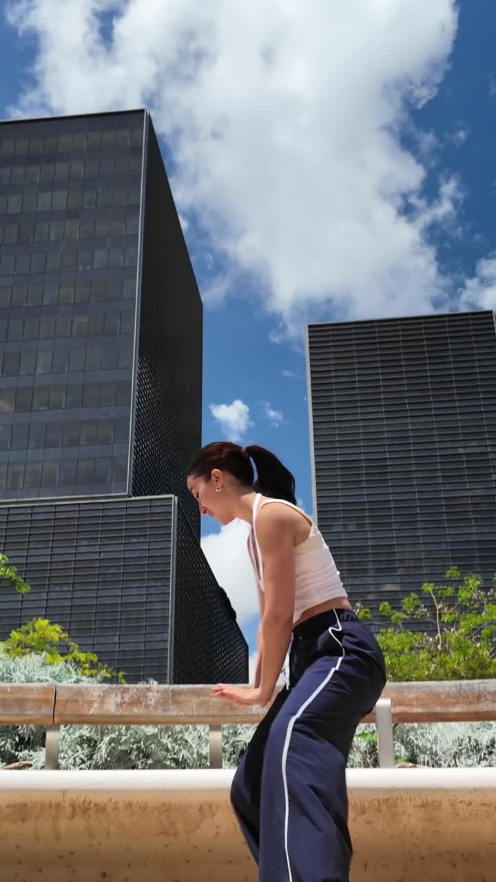 Woman in front of modern buildings