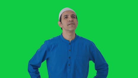 confused muslim man thinking about something green screen