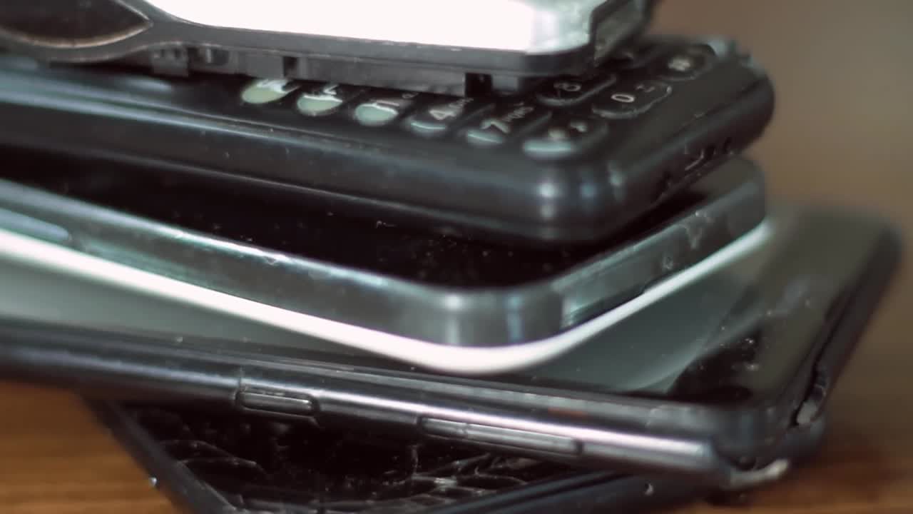 Pile of Old and Broken Cell Phones