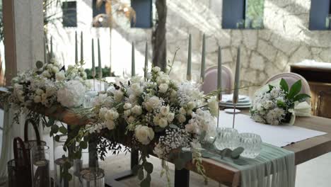 elegant wedding table decor with white flowers and candles