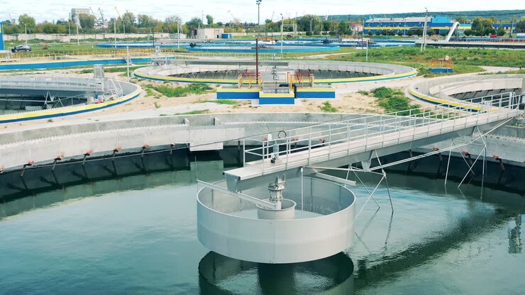 Big circular clarifiers at a wastewater treatment station. Drone shot