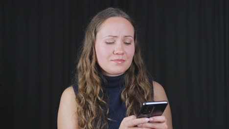 Woman-texting-on-phone-looks-up-talking-then-back-at-phone-lips-flare-out-then-relaxes-mouth