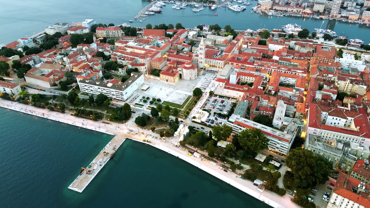 Aerial drone view of Zadar in evening, Croatia. Historical city centre with old buildings and water channels