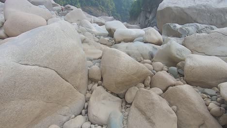 naturally formed white shiny stone in unique shape at dry river bed at morning video is taken at sliang wah umngot amkoi jaintia hill meghalaya india