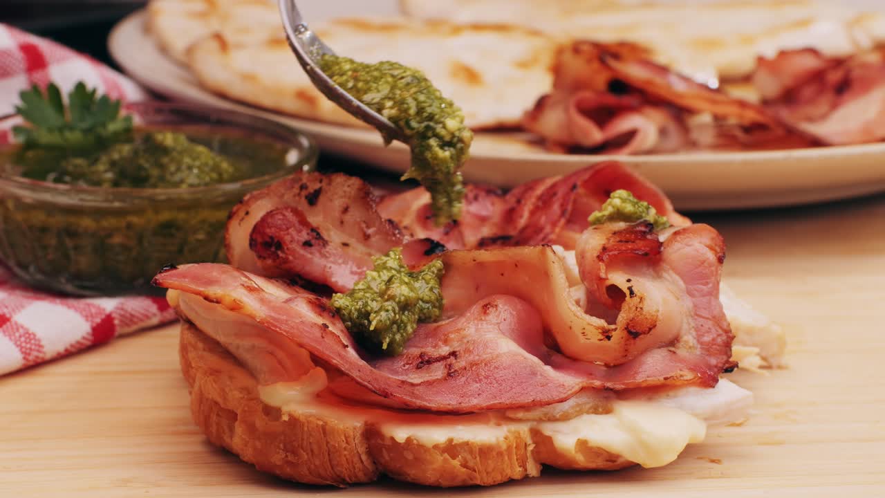 Croissant with jamon ham, Salmon, in Modern Cafe, Top View of Healthy Breakfast in Cafe. English breakfast: fried egg, bacon toast on sandwich.