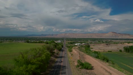 grand junction colorado river aerial drone forward motion summer grand mesa downtown main street afternoon cloudy blue sky wine vineyards parachute fruitvale mt garfield western slope cars traffic