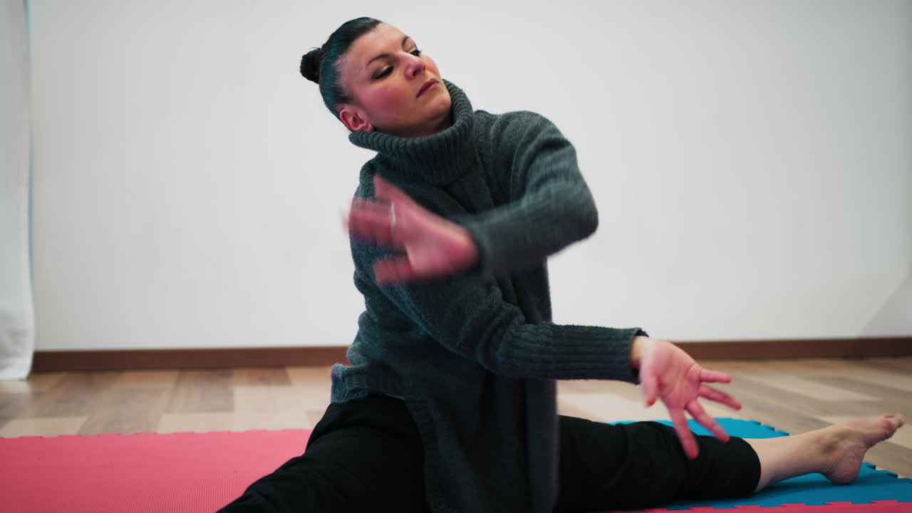 Woman Tries New Dance Moves On Tatami Mats In Indoor Ballroom